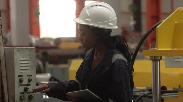 Corporate executives inspecting manufacturing operations while discussing production strategy with engineering professionals and factory workers inside an industrial facility.