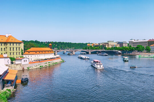 Passenger ship swim on Vltava river in Prague, Czech Republic. Ferry swimming on river in city, summer vacations