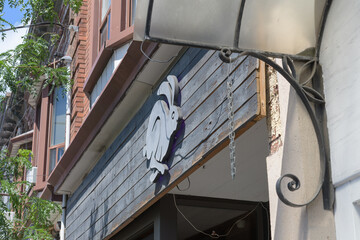 Obraz premium novelty sign outside Conejo Negro, a restaurant, located at 838 College St, Toronto