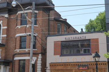Obraz premium exterior building facade and ghost sign of Grappa Ristorante now Bar Isabel at 797 College St, Toronto