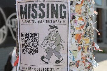 Obraz premium street poster in Toronto stapled to a well used pole outside (Missing, Uncle Pete's Bread Co, 582 College St)