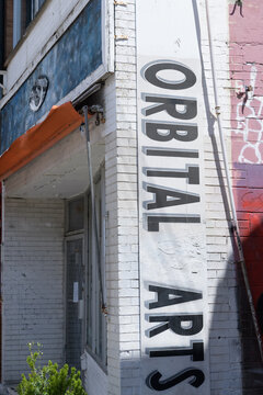 banner on the exterior of Orbital Arts Gallery located at 275 Augusta Av, Kensington Market, Toronto
