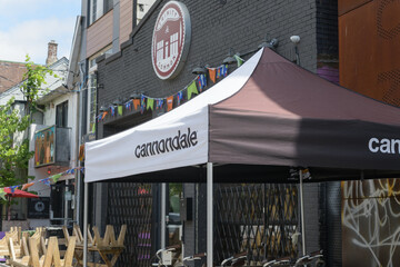 Obraz premium cannondale event tent outside Bikes on Wheels, bicycle shop, located at 299 Augusta Av, Kensington Market, Toronto