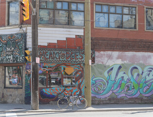Obraz premium exterior of Sneaky Dee's, a restaurant and live music venue, located at the southeast corner of 431 College St and Bathurst St, Toronto