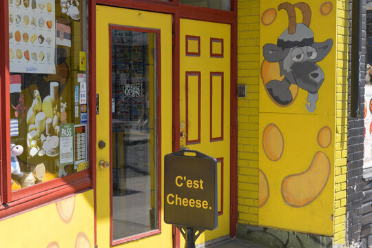 entrance to the colorful Cheese Magic shop at 182 Baldwin St in Kensington Market, Toronto