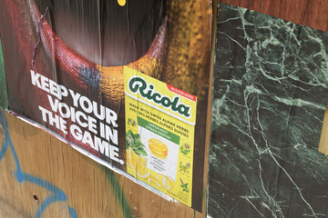 Obraz premium close-up detail of a wheatpaste poster in Toronto (Ricola with slogan re soccer tournament 