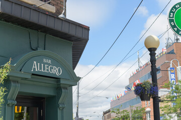 Obraz premium sign over entrance to Bar Allegro located at 597 College St, Toronto