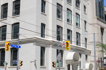 Obraz premium Starbucks coffee signs outside 322 King St W, the 1903 Eclipse Whitewear Building, a former underwear factory, Toronto