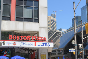 Obraz premium exterior building and sign of Boston Pizza restaurant and sports bar, located at 250 Front St W, Toronto