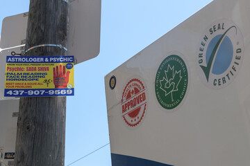 Obraz premium astrologer & psychic sign including logos on the side of a truck in Toronto (health canada approved, environmental choice, green seal certified)
