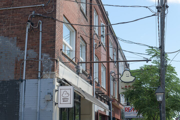 Obraz premium exterior signage outside Gateau Ghost, a restaurant, located at 974 College St, Toronto