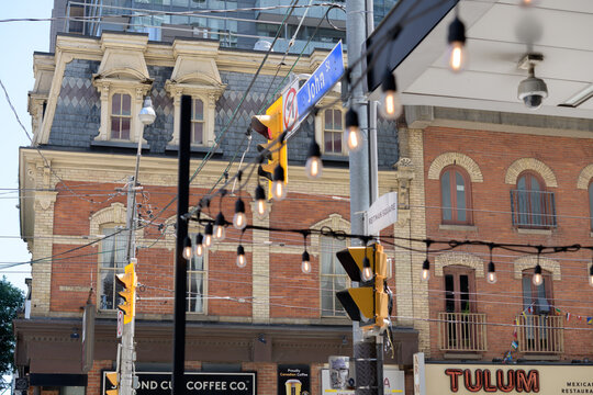 abstract view of William Barber Building (Second Cup Cafe sign) and George Garden Building (Tulum restaurant) located at 287-289 and 291 King St, Toronto