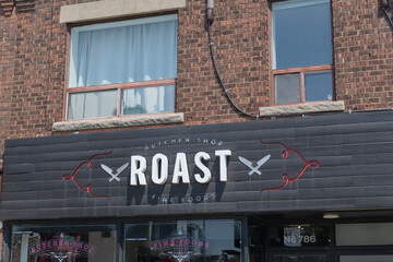 Obraz premium exterior building facade and sign of Roast Fine Foods, a butcher shop, located at 786 St Clair Av W, Toronto
