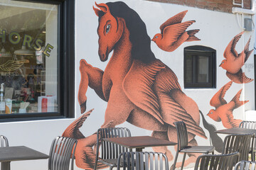 Obraz premium mural (by La Pupila and AlfAlfA) on the exterior wall of Dark Horse Espresso Bar, 120 Geary Av, Toronto