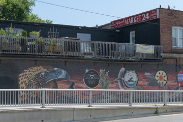 Obraz premium ghost sign, patio, and mural sponsored by Toronto's Dupont by the Castle BIA, located by underpath at Spadina Rd just north of Dupont St