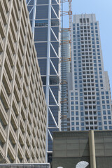 Obraz premium architectural patterns of buildings (left to right) Manulife Centre, One Bloor West, and The Uptown Residences, all near Yonge St and Bloor St, Toronto