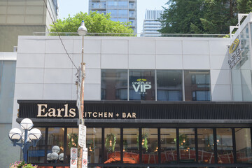 Obraz premium exterior view with sign of Earls Kitchen + Bar, a restaurant, located at 55 Bloor St W, Unit 113, inside Manulife Centre, Toronto