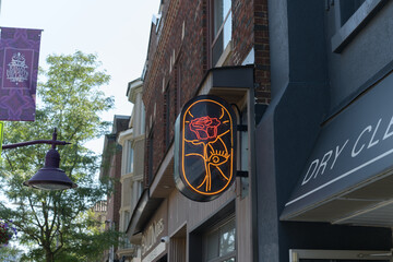 Obraz premium wall mounted projecting neon sign outside Rosa’s, a restaurant, located at 1067 St Clair Av W, Toronto