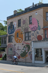 Obraz premium big floral mural on the north elevation of 215 Madison Av location of Gleam & Sip matcha & espresso catering and cafe, Dupont by the Castle BIA, Toronto
