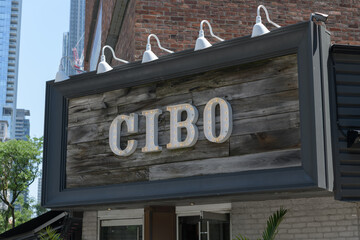 Obraz premium exterior building and sign of Cibo Wine Bar, an Italian restaurant, located at 133 Yorkville Av, Toronto