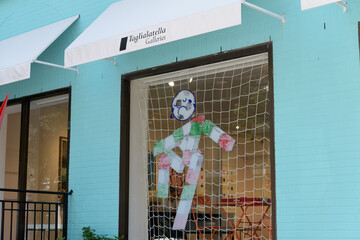 Obraz premium display window and sign of Taglialatella Galleries with Stikki Peaches “Make The Azzurri Great Again” exhibition decal with a sad face (