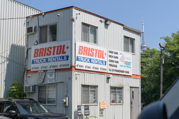Obraz premium old building with signs at Bristol Car and Truck Rental Toronto (79 Nassau St, near Kensington Market)