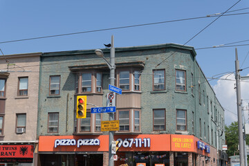 Obraz premium apartment and commercial block and location of Pizza Pizza, 950 St Clair Av W at Oakwood, Toronto