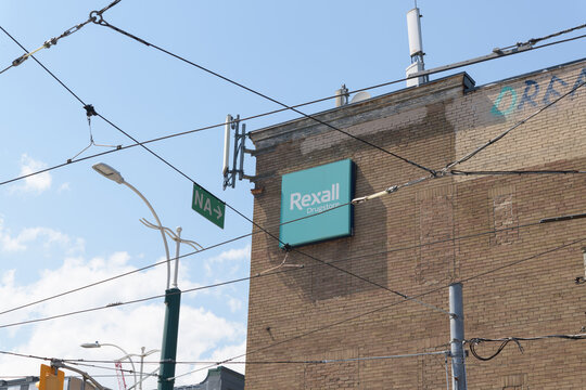 brick wall with sign of Rexall, a drug store chain, located here at northeast corner of Dundas St W and 285 Spadina Av, Toronto