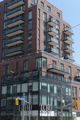 Fototapeta premium exterior view of building known as 900 St Clair West, a condominium complex, and the location of LCBO, a liquor store chain, Toronto