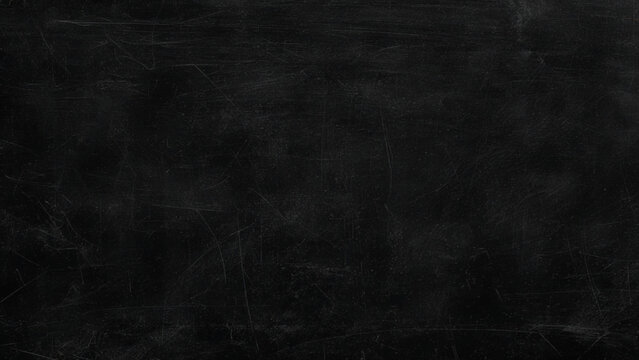 Scratched and worn black surface with scratches and marks all over closeup