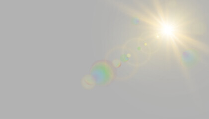 Fototapeta premium Glowing golden white radiant sun in sky with multicolor rainbow optical lens flare shining light beam and bright ray isolated on transparent png for realistic light effect design overlay