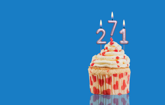 Birthday Or Anniversary Cupcake With Lit Candles; Candles Forming The Number 271
