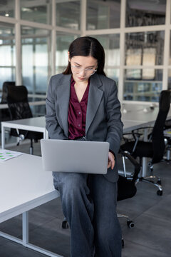 Business woman working with papers in the office