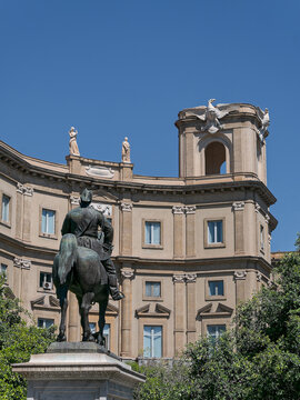 Vertical image of bronze horse sculpture monument at Piazza Giulio Cesare in Palermo, Sicily. Italian landmark and decorative urban architecture, perfect for European travel and tourism.