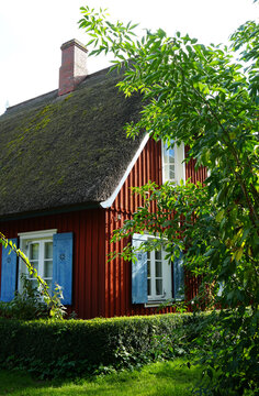 Red wood house with traditional roof, Ahrenshoop, Baltic Sea