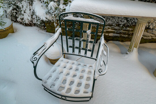 Patio Furniture and Plants Covered in Snow after Historic Snowfall (10 inches), on the Patio of an Uptown home in New Orleans, LA, USA on January 21, 2025