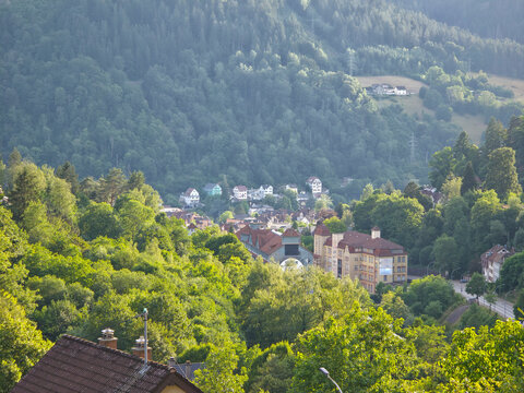 germany, breathtaking elevated sunset view across schramberg village surrounded by lush schwarzwald hills under crystal clear summer evening blue sky