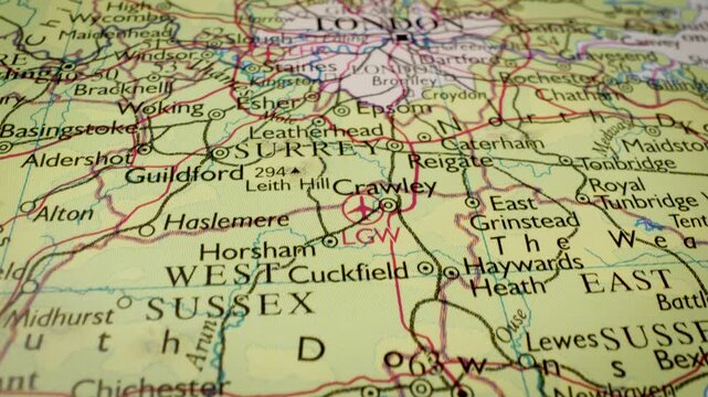 Gliding view over map showing the network of towns and roads leading to London, England