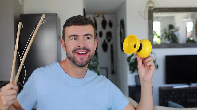 Man using a yellow diabolo