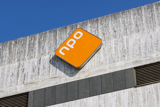 Hilversum, Netherlands - July 13, 2026: A close-up shot of the distinctive orange diamond-shaped logo NPO of the Nederlandse Publieke Omroep public broadcasting system on a concrete wall.