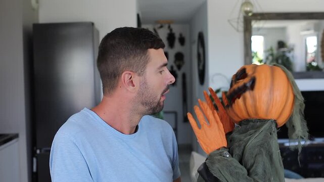 Man Seeing a Creepy Halloween Pumpkin Creature