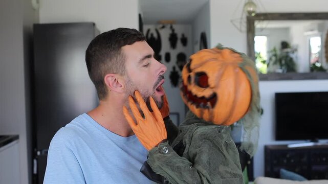 Man Kissing Creepy Halloween Pumpkin Creature