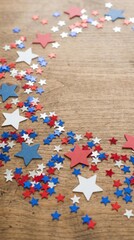 Fototapeta premium Red, white, and blue star confetti on wooden background