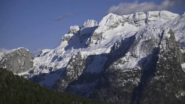 Beauty and fun at the foot of the Montasio plateau. Julian Alps in winter.