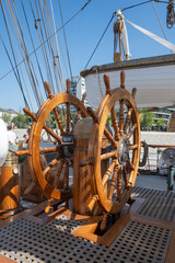 Wooden ship steering wheel on a classic sailing vessel in Antwerp, Belgium © kristof Leffelaer