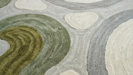 Obraz premium Abstract texture of green and grey circular brush strokes painted on a rough concrete wall surface
