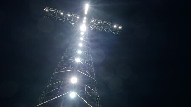 Illuminated Cross Monument on Morro Solar at Night in Lima, Peru