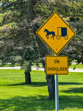 Yellow horse and carriage caution traffic sign in Shipshewana, Indiana, USA with room for text