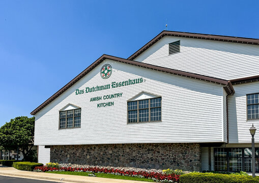 Exterior of the Das Dutchman Essenhaus Amish Country Kitchen Restaurant against blue sky.
Middlebury, IN USA - July 8, 2026