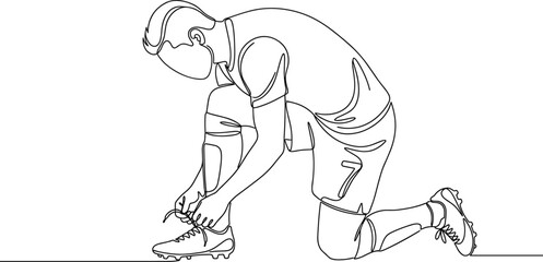 Obraz premium Continuous one line drawing of a soccer player tying his shoelaces.